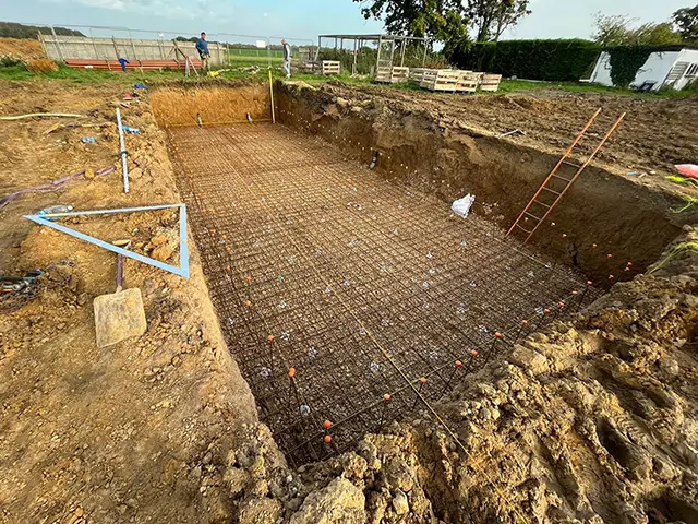 A large excavation in preparation for a swimming pool.